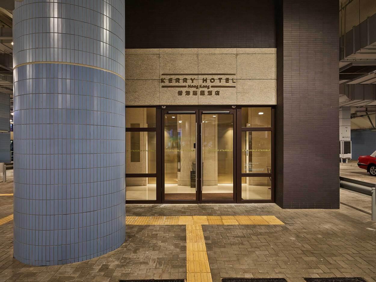 Entrance of an underground parking garage with glass doors and modern design